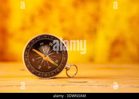 Compass on wooden background, travel and adventure concept, copy space Stock Photo