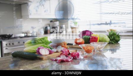 Displaying romaine, halved red onion, chef's knife on wood board at kitchen island with HUD overlay Stock Photo