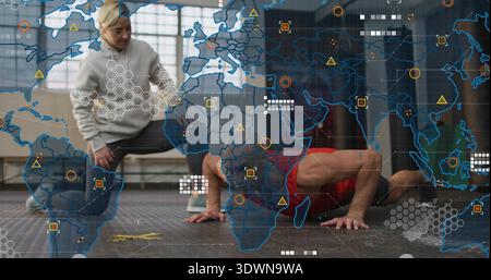 Coaching trainer kneeling gray top guiding man red top doing pushups in gym studio, HUD overlay Stock Photo