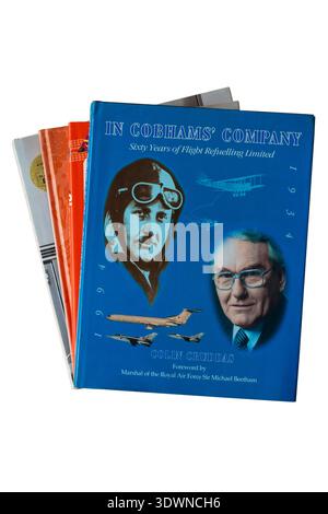 Selection of hardback books with In Cobhams' Company Sixty Years of Flight Refuelling Limited book by Colin Gruddas on top isolated on white Stock Photo