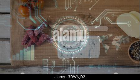 Showing wooden cutting board with blue cheese, salami, tomatoes on white table with HUD overlay Stock Photo