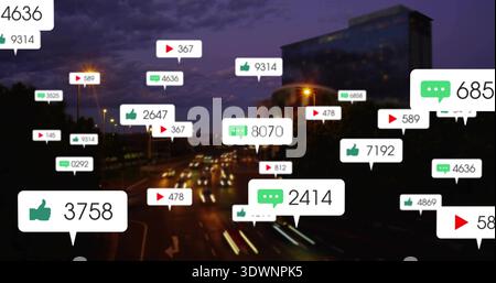 Displaying floating speech bubbles and play icons over dusk urban highway, showing car light trails Stock Photo
