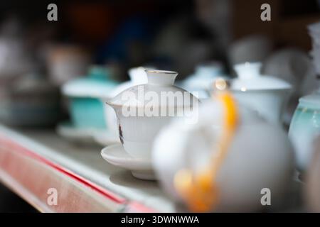 Traditional Chinese tea set with lid displayed on shelf in Beijing market Stock Photo