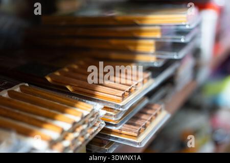 Stacks of packaged wooden pencils displayed on store shelves in Tokyo, Japan Stock Photo