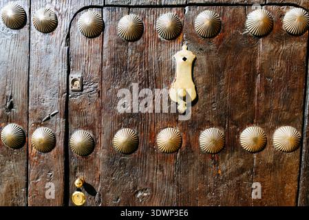Detail. Old door with metal tacks. Ronda, Málaga, Andalucía, Spain, Europe Stock Photo