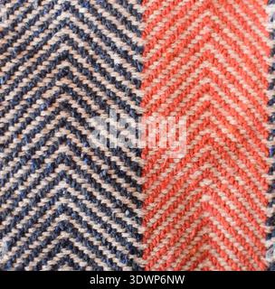 A vibrant zigzag fabric texture featuring alternating blue and red colors. Realistic woven pattern with visible threads, perfect for textile design Stock Photo