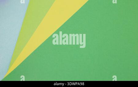 sheets of colored paper. Many colored sheets of paper are laid out in the harsh composition. background of colored paper. place for text. view from th Stock Photo