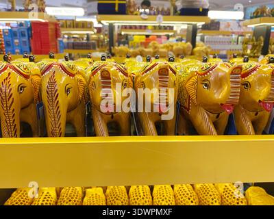 Mumbai, India - October 22, 2025: Decorative elephant souvenirs in bright colors arranged on shelves at a gift shop in Mumbai airport, highlighting In Stock Photo
