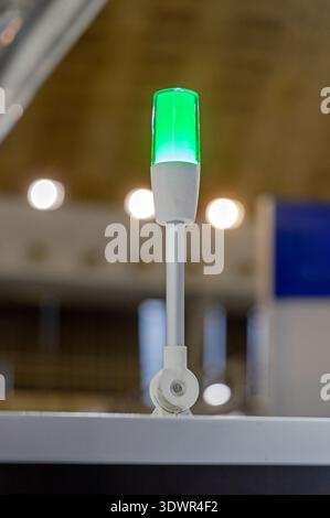 Pure Green OK Led Stack Signal Lights at Top of Machine Factory Production Stock Photo