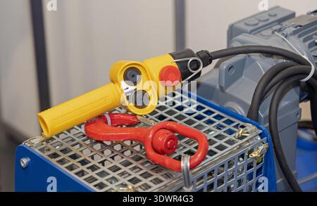 Wired Remote Control Lifting With Emergency Stop Button in Workshop Stock Photo