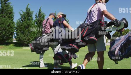 Walking four golfers carrying golf bags across fairway with trees, wearing sun hat, masks, overlays Stock Photo