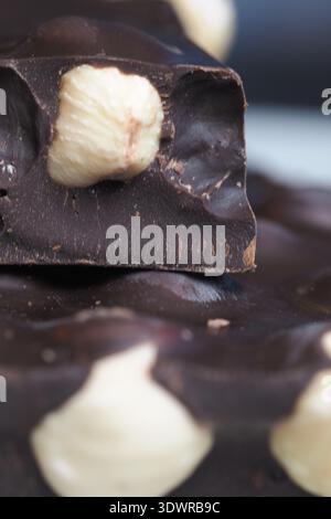 Chocolate bar with nuts on a flat surface Stock Photo