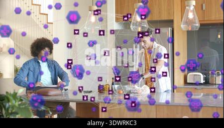 Talking men denim jacket striped tee handling laptop, oranges on home kitchen island, purple AR Stock Photo