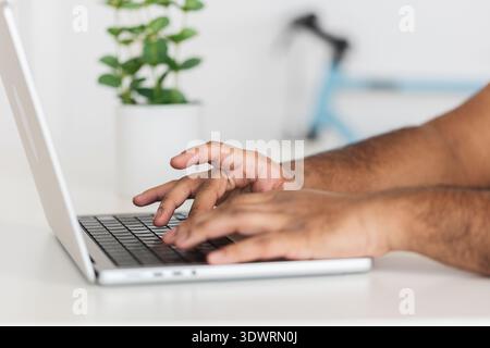 Close up hands using laptop computer Stock Photo