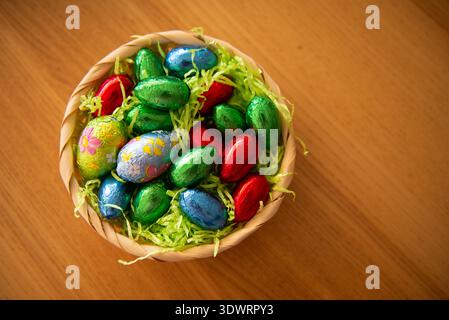 Basket with chocolate colored eggs Easter decor Stock Photo