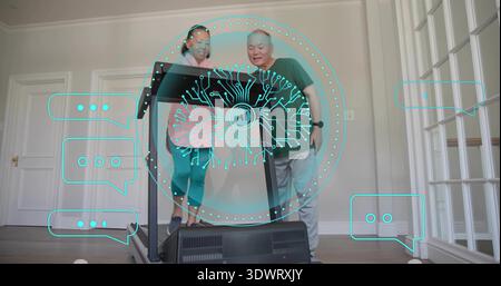 Standing couple in workout clothes checking treadmill display in home gym, with AI graphic overlay Stock Photo