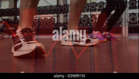 Standing white-black sneakers centered on gym floor with pink shoes gym gear dumbbells red overlay Stock Photo