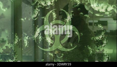 Dominating biohazard symbol overlaying lab corridor showing virus particles silhouette in lab coat Stock Photo