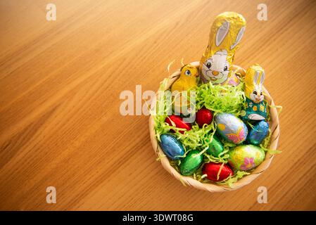 Basket with chocolate colored eggs Easter decor Stock Photo