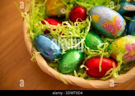 Basket with chocolate colored eggs Easter decor Stock Photo