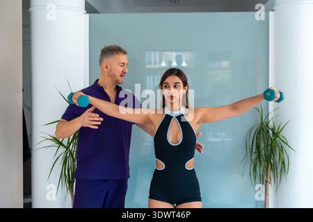 Woman undergoing physical therapy treatment for sports recovery Stock Photo