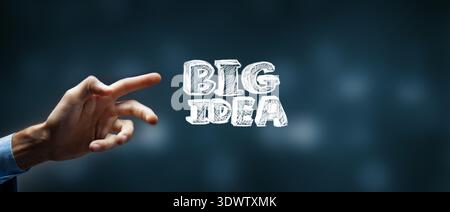 Businessman on blurred background touching big idea text with his finger Stock Photo