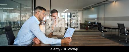 Financial advisor consulting investor explaining financial trade stock market. Stock Photo