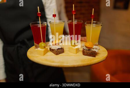 Liqueurs of different colors in shot glasses Stock Photo