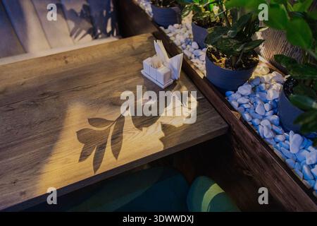 Beautiful wooden table in a restaurant with cozy lighting Stock Photo