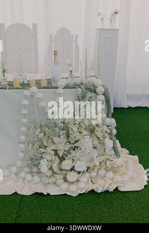 Decorating a wedding table with fresh flowers Stock Photo