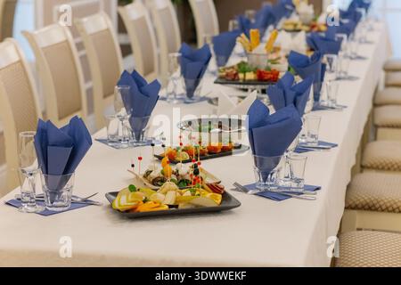 A festive table set with snacks for guests Stock Photo