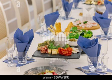 A festive table set with snacks for guests Stock Photo