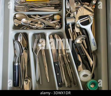 the hague, the netherlands - February 28 2026: a messy cutlery drawer in the household kitchen Stock Photo
