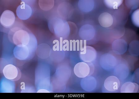 Soft bokeh effect with luminous circles of light, offering a stylish and atmospheric backdrop for creative visuals. Stock Photo