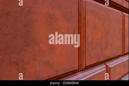 Textured Terracotta Stone Wall with Decorative Rectangular Rustication Stock Photo