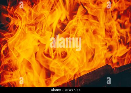 Bright fire flames close-up abstract burning background texture Stock Photo