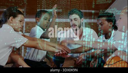 Joining coach and team forming hand stack on gym floor, wearing matching polos, HUD overlay Stock Photo