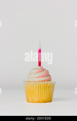 A vanilla cupcake on white background Stock Photo
