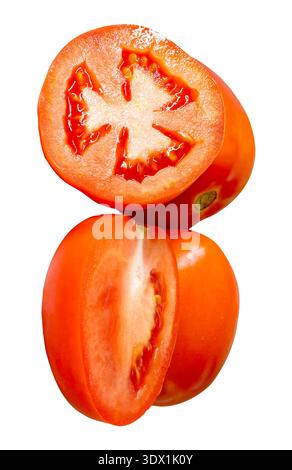 Two ripe red tomato fruits with two halves in stack are isolated on white background with clipping path. Stock Photo