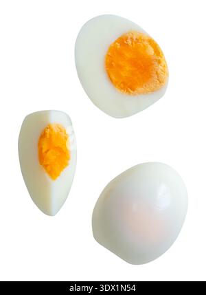 Top view set of cooked or boiled unpeeled chicken egg with egg yolk in whole  and half with quarter is isolated on white background with clipping path Stock Photo
