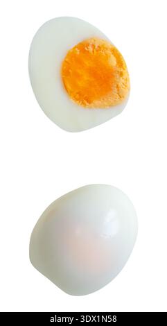 Top view set of cooked or boiled unpeeled chicken egg with egg yolk in whole  and half is isolated on white background with clipping path. Stock Photo