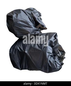 Garbage in black garbage bags in stack at garbage dump is isolated on white background with clipping path. Stock Photo