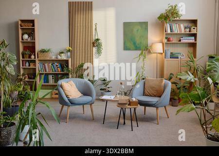 Modern Psychologist Office Interior Featuring Cozy Seating and Green Plants Stock Photo