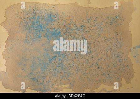 Blue chalk dust and earth creamy tones smudges on beige cardboard paper, abstract close up backdrop Stock Photo