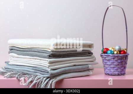 A stack of folded blankets, sheets and towels. Stock Photo