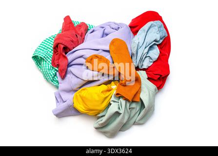 Pile of colored dirty clothing t-shirt, shirt, socks before washing isolated on white, top view Stock Photo
