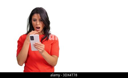 Woman feeling surprised reading news on smartphone Stock Photo