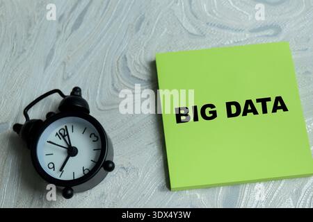 Concept of big data write on sticky notes isolated on Wooden Table. A key solution data integration and strategic information insights in business Stock Photo