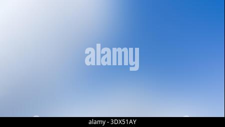 Abstract background creating a natural gradient of blue and white colors, offering a soft blurred effect for various designs Stock Photo