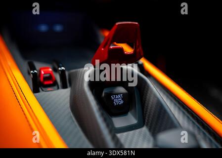 Orange Lamborghini Revuelto cockpit with red flip cover and start button Stock Photo